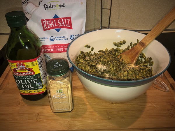 raw pumpkin seeds, olive oil, salt, and garlic powder